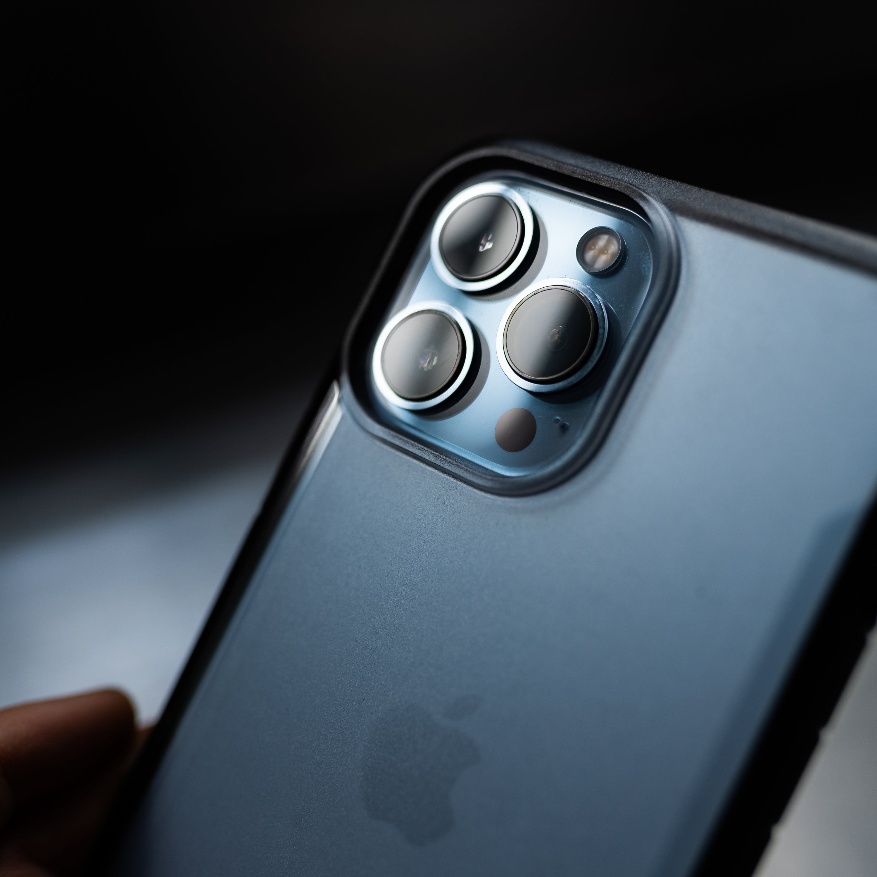 The eco-friendly iPhone 13 Pro Case - TERRAIN by Raptic with a camera on it.